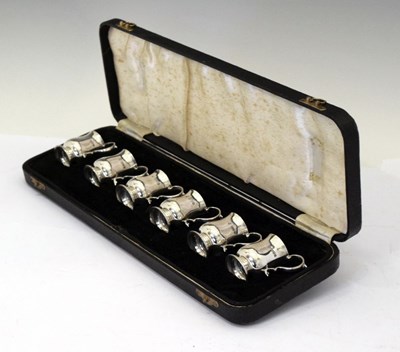 Lot 86 - Cased set of six Edward VII silver tot measures in the form of miniature baluster mugs