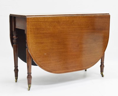 Lot 653 - Mahogany and string inlay gateleg dining table