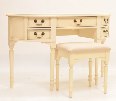 Lot 634 - Laura Ashley - Bow front dressing table and matching footstool