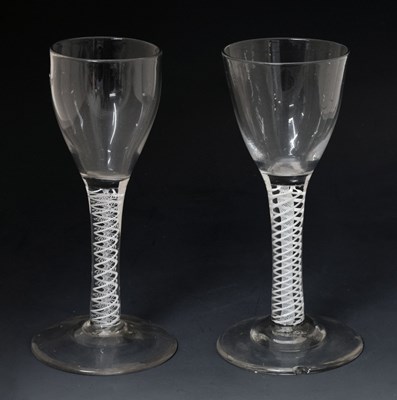 Lot 46 - Two similar opaque twist stem wine or cordial glasses