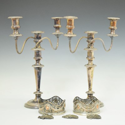 Lot 233 - Pair of plate on copper candelabra and pair of bottle coasters