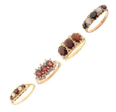 Lot 75 - Four assorted 9ct gold garnet set dress rings