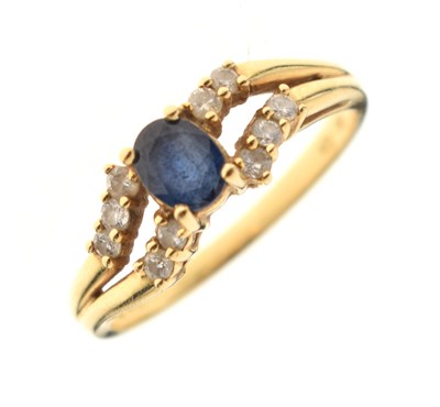 Lot 117 - 18c gold, sapphire and white sapphire dress ring