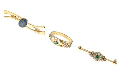 Lot 84 - 9ct gold pierced ring having foliate decoration and set emeralds and diamonds