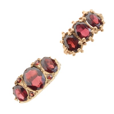 Lot 25 - Two 9ct gold garnet dress rings