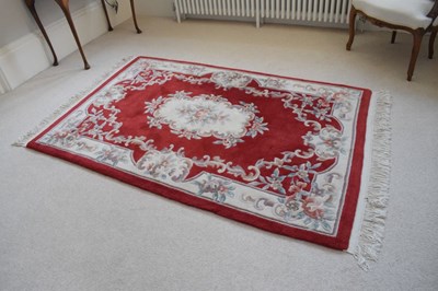 Lot 753 - Chinese claret ground wool rug