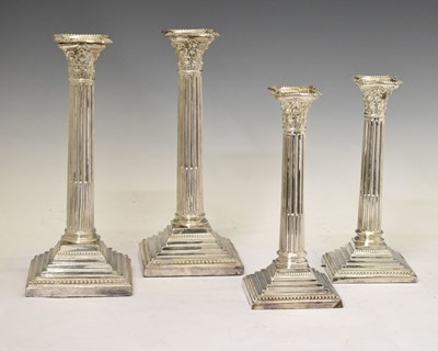 Lot 341 - Two pairs of silver plated Corinthian column candlesticks