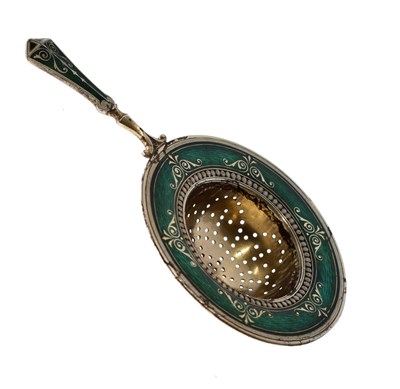 Lot 88 - Norwegian white metal tea strainer with classical green enamel decoration