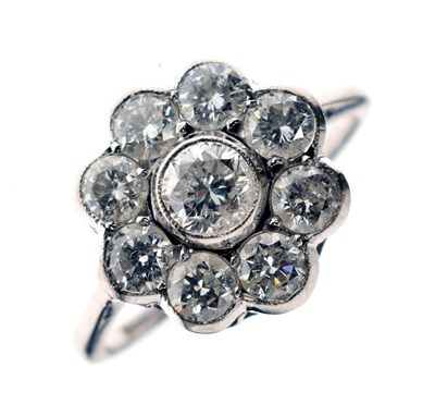 Lot 10 - Diamond nine stone daisy cluster ring