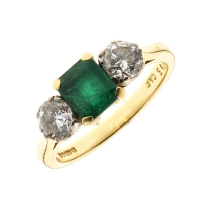 Lot 16 - Diamond and emerald three stone 18ct gold ring