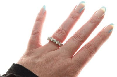 Lot 9 - De Beers Allegria diamond platinum full eternity ring