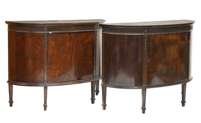 Lot 696 - Pair of 1920s inlaid mahogany demi-lune side cabinets in the Adam Revival taste