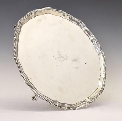 Lot 106 - Victorian silver salver with gadroon edge and standing on four ball and claw feet