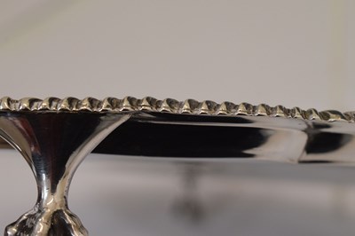 Lot 106 - Victorian silver salver with gadroon edge and standing on four ball and claw feet