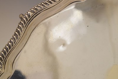Lot 106 - Victorian silver salver with gadroon edge and standing on four ball and claw feet
