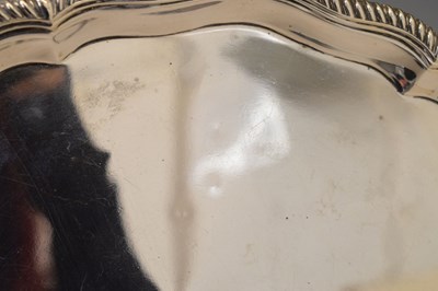 Lot 106 - Victorian silver salver with gadroon edge and standing on four ball and claw feet