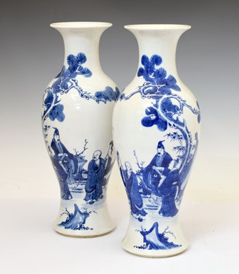 Lot 334 - Pair of Chinese Qing Dynasty blue and white porcelain baluster vases
