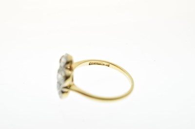 Lot 11 - Diamond 18ct yellow gold and platinum flower head ring