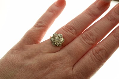 Lot 11 - Diamond 18ct yellow gold and platinum flower head ring