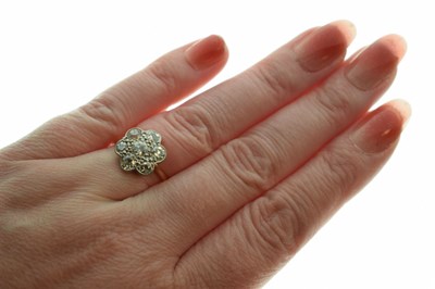 Lot 11 - Diamond 18ct yellow gold and platinum flower head ring