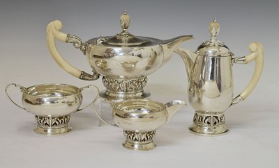 Lot 121 - George V silver four-piece tea-set with ivory handles