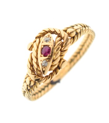 Lot 29 - Ruby and diamond 18ct gold rope twist ring