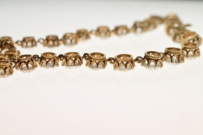 Lot 55 - Yellow metal and white paste rivière necklace