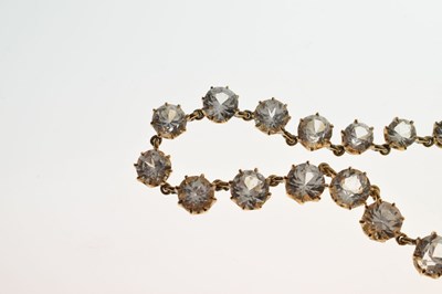 Lot 55 - Yellow metal and white paste rivière necklace