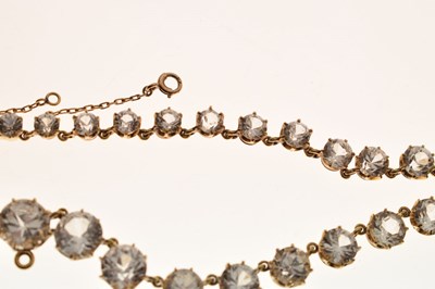 Lot 55 - Yellow metal and white paste rivière necklace