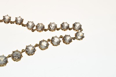 Lot 55 - Yellow metal and white paste rivière necklace