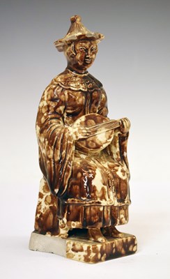 Lot 296 - Unusual Whieldon-glazed pottery figure of a Chinese musician