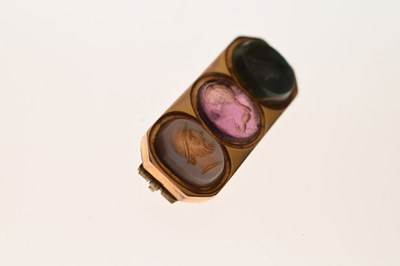 Lot 25 - Yellow metal brooch set three carved hardstone intaglios