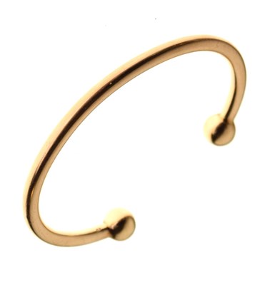 Lot 51 - Yellow metal torque bangle, stamped 375, 31.5g
