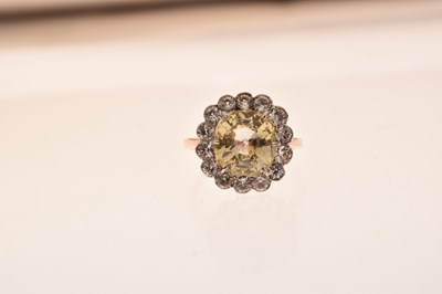 Lot 15 - Yellow sapphire and white sapphire rose metal cluster ring, boxed