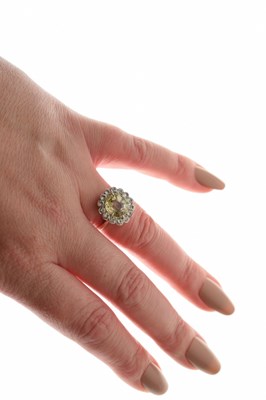 Lot 15 - Yellow sapphire and white sapphire rose metal cluster ring, boxed