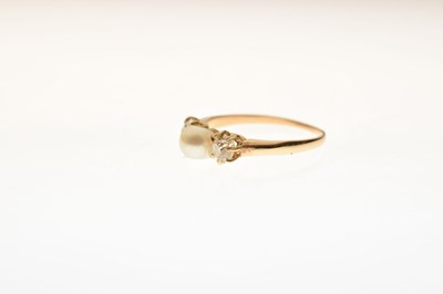 Lot 14 - Pearl and diamond yellow metal ring