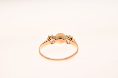 Lot 14 - Pearl and diamond yellow metal ring