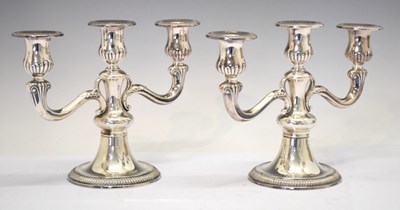 Lot 122 - Pair of German late 20th Century 800 standard three-branch candelabra