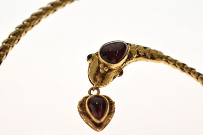 Lot 47 - Victorian garnet set yellow metal serpent pendant necklace, the textured snake head set with garnet carbuncle