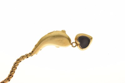 Lot 47 - Victorian garnet set yellow metal serpent pendant necklace, the textured snake head set with garnet carbuncle