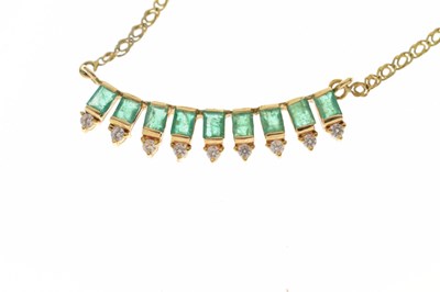 Lot 50 - Emerald and white stone 14ct yellow gold fringe necklace