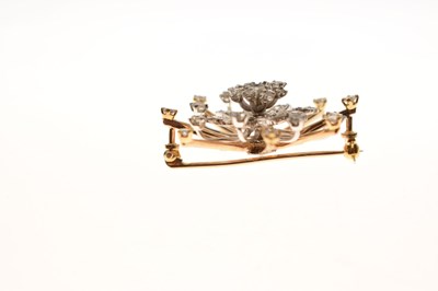 Lot 27 - Diamond yellow and white metal flower head starburst brooch