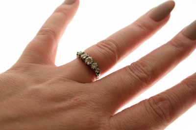 Lot 8 - Late 19th century diamond yellow metal ring, five graduated old cut diamonds