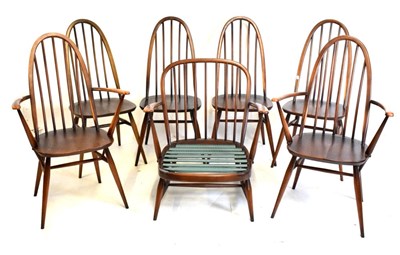 Lot 517 - Ercol dark elm dining suite