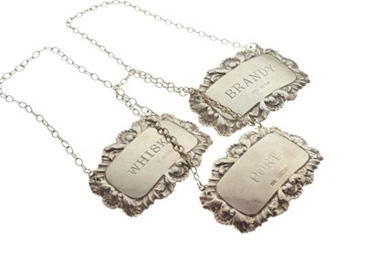 Lot 166 - Three Elizabeth II silver spirit or decanter labels