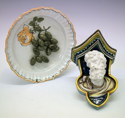 Lot 401 - Continental majolica wall bracket together with a tin glazed olive dish