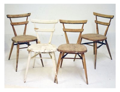 Lot 775 - Set of four Ercol Green Dot Stacking chairs