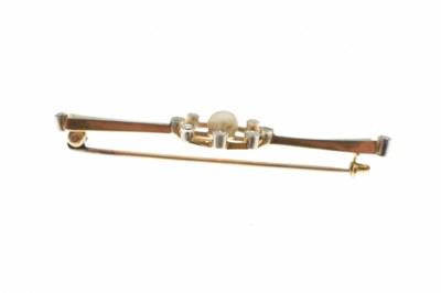 Lot 35 - Edwardian pearl and diamond yellow and white metal set bar brooch