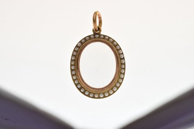 Lot 43 - Late 19th century seed pearl 15ct yellow gold locket pendant