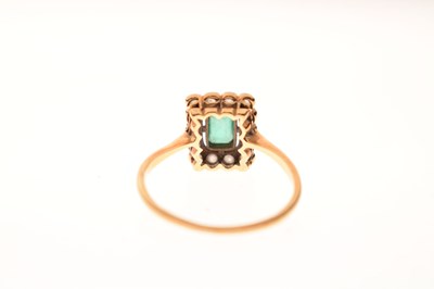 Lot 18 - Emerald and diamond 18ct yellow gold cluster ring